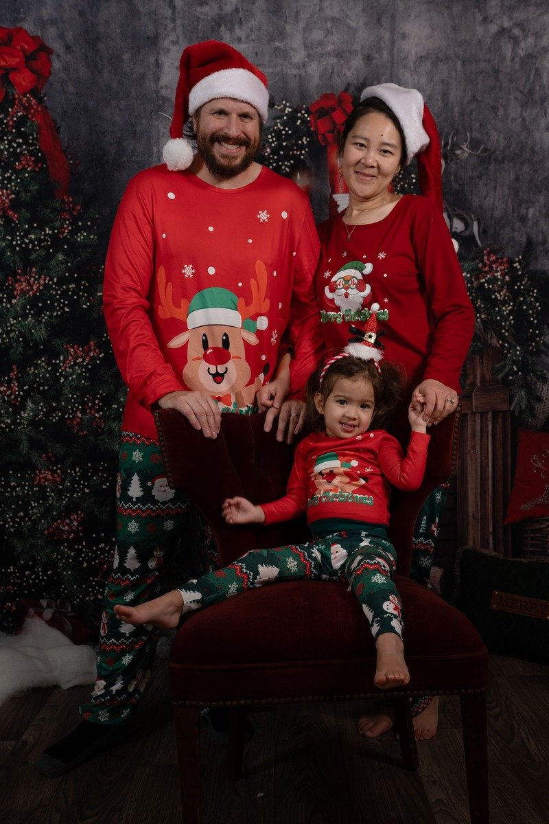 Kids wearing Santa hats and matching Christmas tees
