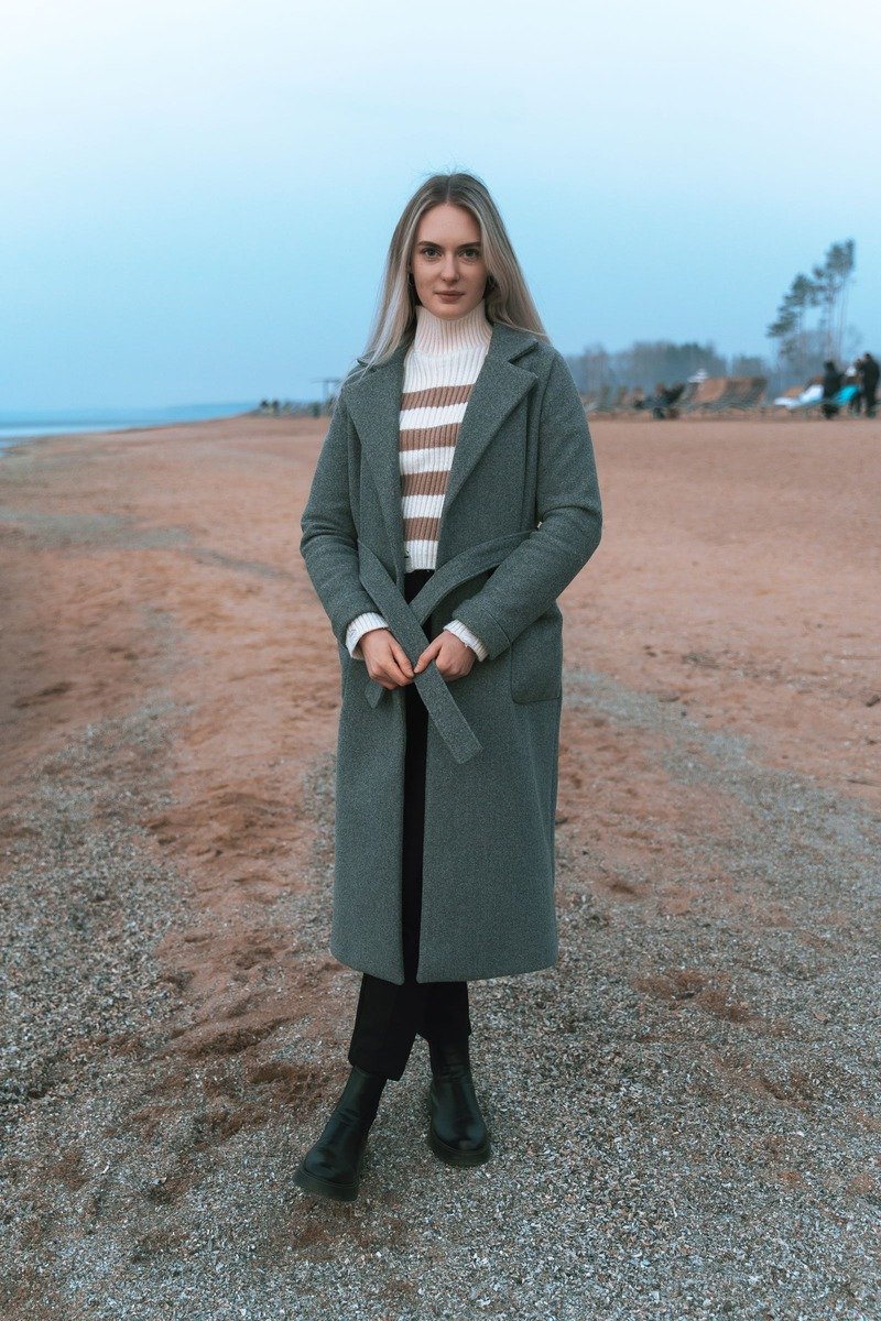 Layered winter office outfit with a long coat