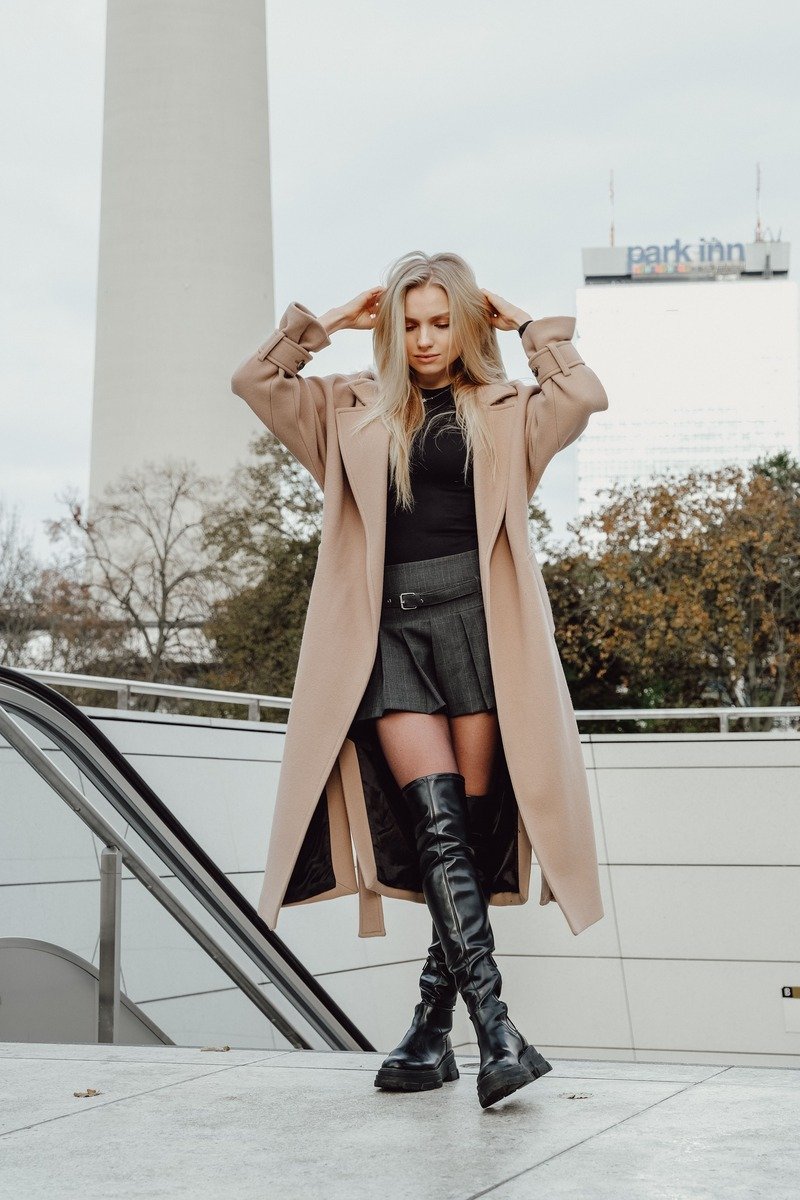 Long coat over a mini skirt outfit