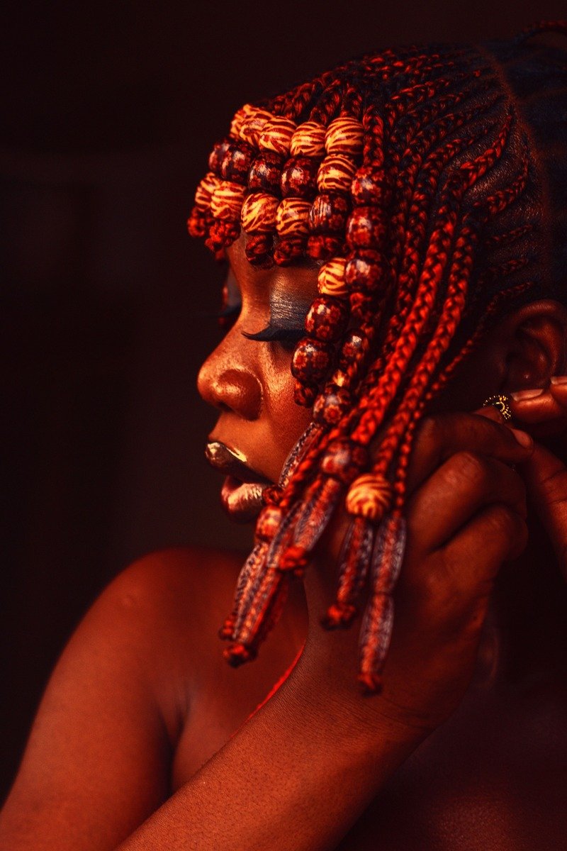 Braided hairstyle in cherry cola hair color