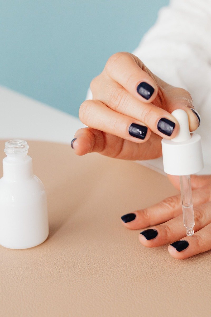 Cuticle oil being applied to nails