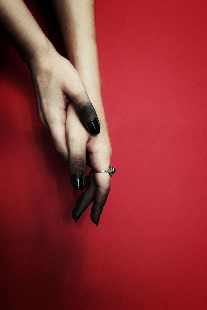 Black nails with red heart and tip details