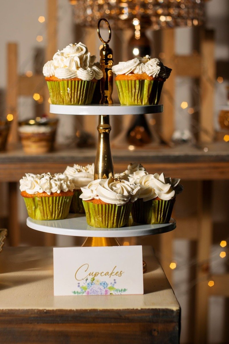 Tiered treat stand with cupcakes on a birthday table