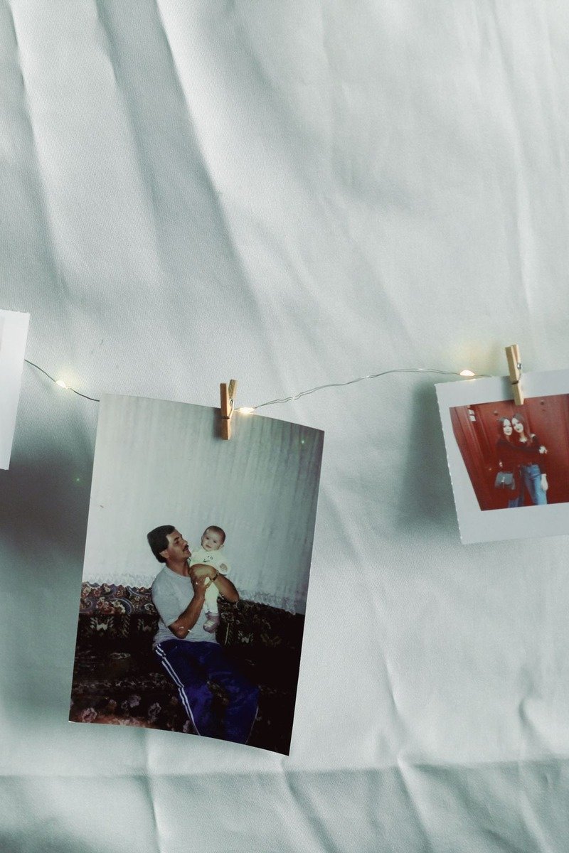 Photos hanging on a string garland with clothespins at a birthday