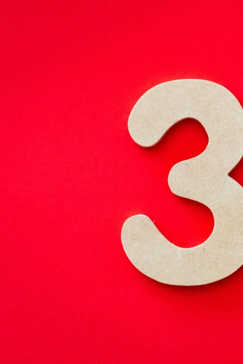 Large cardboard numbers decorated for a birthday party